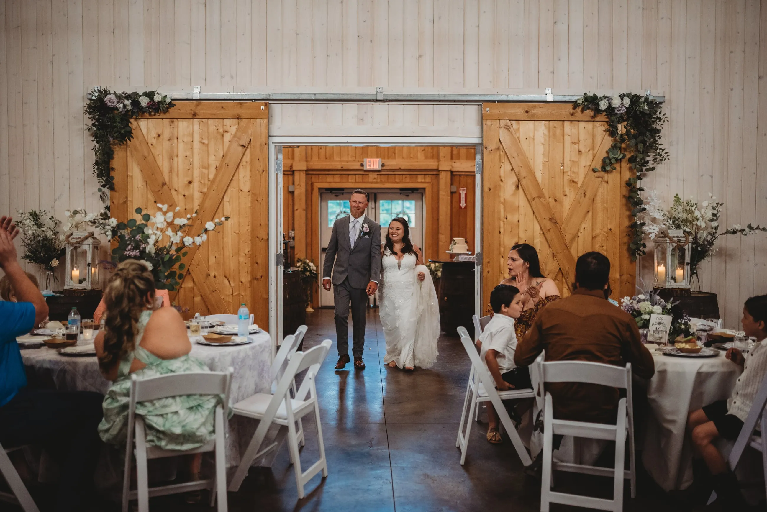 Wedding party entering the red barn at The Heritage Barn